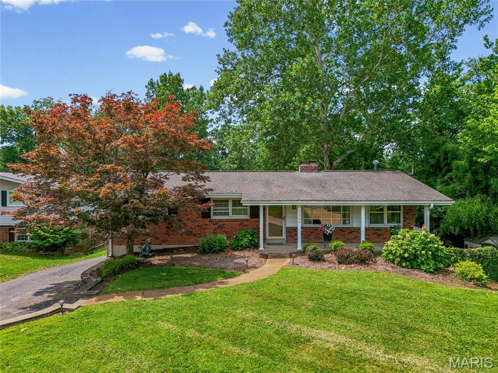 Come see this 4-bd, 3-bt, ranch home in Sunset Hills on .85/acre picturesque property in a fantastic subdivision and Lindbergh School District.  Enter the main floor to a large living room with bamboo luxury plank flooring throughout. Move through to the large dining room with a wood-burning fireplace and matching built-in shelves on either side, which opens to a beautiful kitchen with stainless steel appliances, updated fixtures, custom white cabinetry, granite countertops, a tile backsplash, and a spacious pantry. Hall bath updated, 3 large bedrooms on the main floor, freshly painted, including a large primary bedroom with a private bath with ceramic flooring and a walk-in shower. The lower level has a walk-out, a 4th bedroom with a walk-in closet, an updated walk-in shower, a large recreation room with a wood-burning fireplace, laundry, a separate storage room with lots of shelving, and a 2-car tuck-under garage with a workshop area. The real gem is the ability to relax and enjoy this BEAUTIFUL, serene, large yard with a drum bridge, landscaping, and privacy.  Fantastic for entertaining or just enjoying the view!  Home is being sold as-is, no inspections or occupancy by the seller.