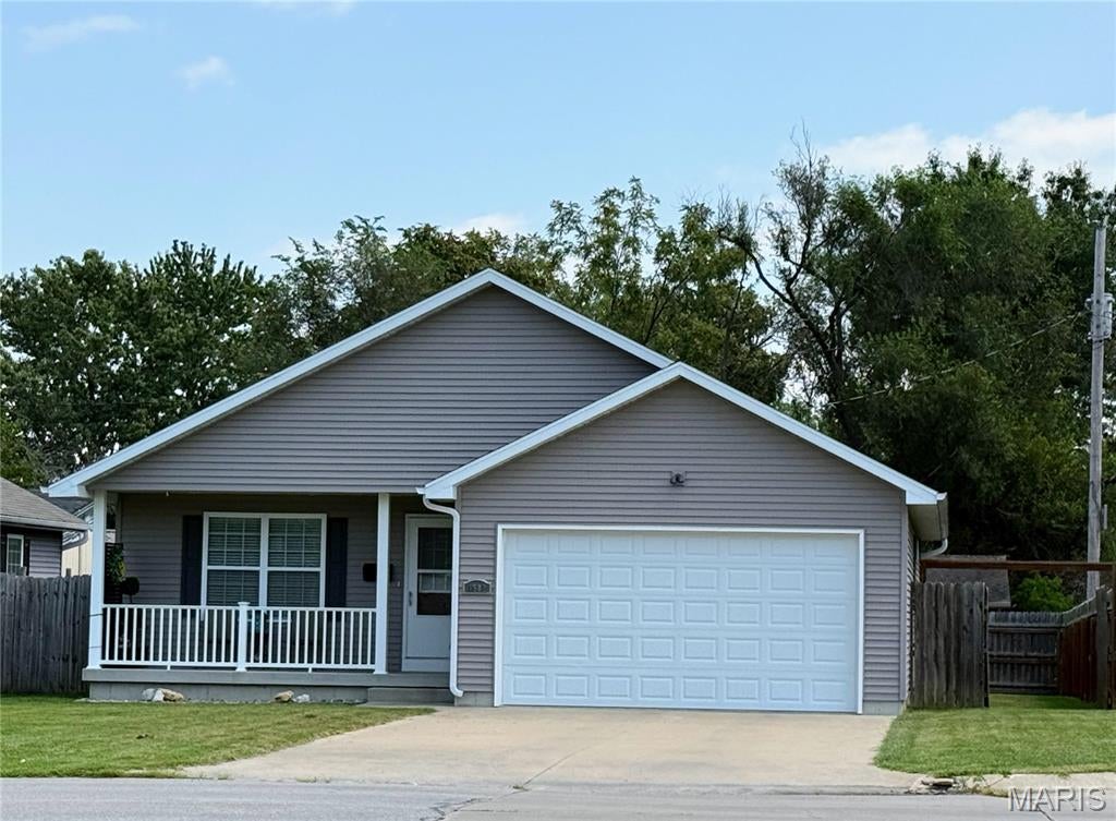 This charming ranch home, built in 2017, is ideally located in Kirksville, MO, close to shopping, hospitals, and schools. Well-maintained and featuring an open floor plan, it boasts a spacious master suite with an ensuite bathroom, a two-car garage, and a privacy fence surrounding the backyard. The large covered back deck and inviting front porch enhance its appeal, making it perfect for outdoor relaxation and entertaining. Priced to sell, this property offers a perfect blend of comfort and convenience for potential buyers.