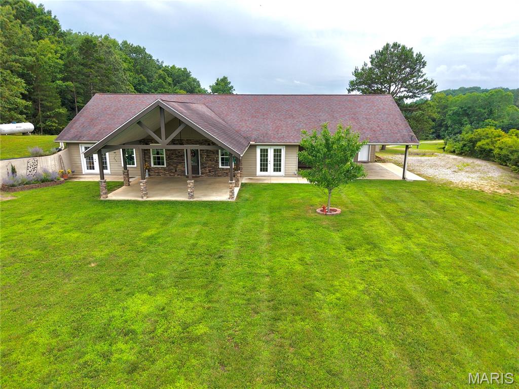 Own your own private oasis with this exceptional 2,464 +/- sq. ft. earth home nestled on 32 +/- acres just outside the city limits. Built in 2014 with high-quality materials, this thoughtfully designed 3-bedroom, 2-bath home offers comfort, efficiency, and lasting craftsmanship. Inside, you’ll find a spacious layout featuring a bonus living room, a beautiful walk-in shower, and heated bathrooms for added comfort during the colder months. Outside, the property includes a convenient carport, covered patio, and a detached metal pole barn, providing ample space for vehicles, equipment, or hobbies. Surrounded by nature and tucked away for privacy, this one-of-a-kind property offers the perfect blend of peaceful country living with the convenience of being just minutes from town!