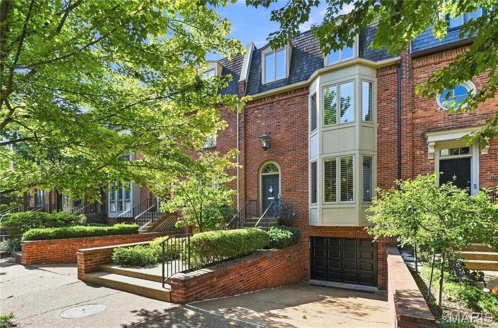 Welcome to 4510 Pershing Place, a classic brick, one-of-a-kind home nestled in one of the Central West End’s most desirable neighborhoods offers an ideal blend of classic character and modern living. The main floor boasts bright, open living and dining spaces. The spacious dining room offers an effortless flow into the kitchen which has been updated and opened up to living room, complete with modern appliances, ample cabinetry, breakfast bar, and generous counter space. Sun-filled living room centered around high ceilings, custom built-ins with lighting, and a cozy fireplace provides access to the private multi-tier back deck, ideal for outdoor dining and relaxing. Closet with antique door and convienent half bath complete the main level. Upstairs, the second level features a luxurious primary suite with 2 balconies and an ensuite bath, an additional bedroom with ensuite bathroom, and convenient second-floor laundry. The third floor provides even more versatile space with a third bedroom, bath, and expansive room options—perfect for a home office, recreation, or guest suite, also features private deck with retractable awning, lighting, and sprinkler system offering amazing views of the Old Cathedral and night stars. Head down to the lower level for a comfortable family room with direct outdoor access and additional half bath. Complete with attached garage parking and unbeatable proximity to Forest Park, dining, and shops.