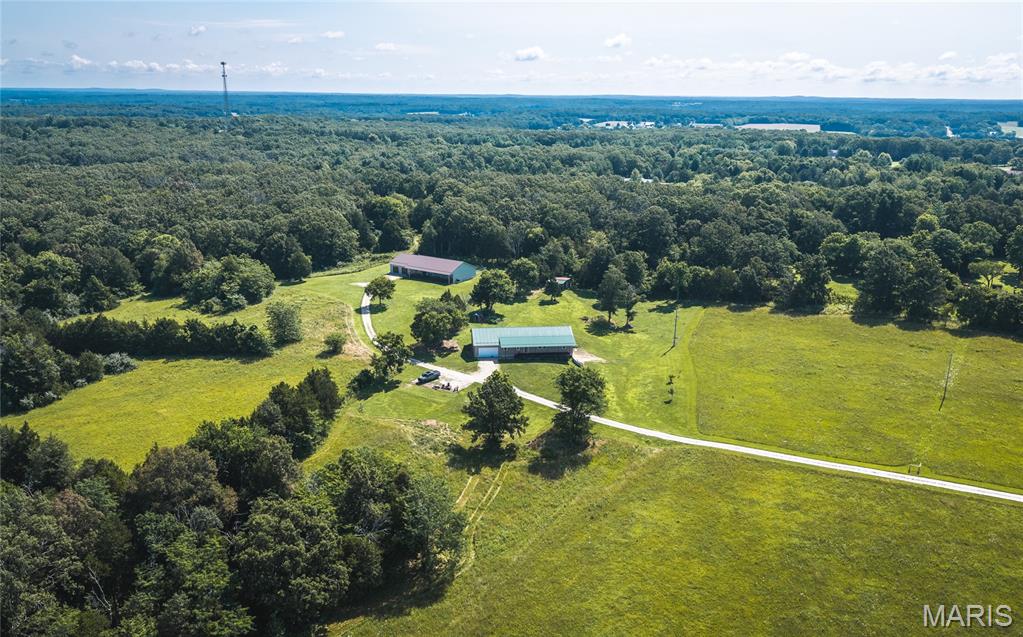 Welcome to your own slice of country paradise! Nestled on 15.32 picturesque acres of mostly open pasture, this spacious 3-bedroom, 2-bath home offers the perfect blend of comfort, functionality, and breathtaking rural views. Whether you're dreaming of a hobby farm, room for horses, or simply a peaceful place to call home, this property delivers the space and freedom you've been searching for. Inside, you'll find approximately 2,400 square feet of thoughtfully designed living space featuring an inviting open floor plan that's perfect for everyday living and entertaining. Luxury vinyl plank flooring flows throughout the main living areas, while generously sized rooms provide plenty of space for family and guests. The oversized pantry keeps the kitchen organized, and the cozy pellet stove offers an efficient way to stay warm while helping reduce heating costs. Recent updates, including a new HVAC system and a new roof installed in 2025, provide added peace of mind for years to come. The full unfinished basement offers extra garage space and endless possibilities for future expansion, storage, or a workshop. The oversized 22' x 40' attached two-car garage provides ample room for vehicles, equipment, and recreational toys. Wake up to panoramic countryside views, enjoy wide-open spaces, and experience the tranquility of rural living—all while having a beautiful home that's ready for its next chapter. Don't miss this incredible opportunity to own acreage with room to grow. Schedule your private showing today! *Also available with 3 acres. MLS #26045537*