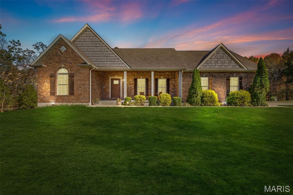 Discover elevated country living in this effortlessly chic retreat, now offered at a newly improved price with motivated sellers ready to make your dream home a reality. Perfectly positioned just 50 miles from the energy of St. Louis and minutes from Farmington, this stunning property delivers the ideal balance of modern comfort, refined style, and peaceful seclusion.

Designed with both beauty and functionality in mind, the home welcomes you with an airy open-concept layout where the living, dining, and kitchen spaces flow seamlessly together—perfect for cozy nights in or sophisticated entertaining. Warm finishes and inviting natural light create a timeless yet relaxed ambiance throughout.

The thoughtfully designed split-bedroom floor plan offers privacy and comfort, featuring a serene primary suite complete with a spacious walk-in closet and spa-inspired en suite bath. Two additional bedrooms are tucked away on the opposite side of the home with a beautifully finished full bath nearby. A main-floor laundry room adds everyday convenience with ease and style.

Downstairs, the walkout basement transforms into the ultimate lifestyle space. Entertain effortlessly with a spacious recreation area and mini-kitchen ideal for hosting game days, celebrations, or casual evenings with friends. A stylish sleeping area with a rustic sliding barn door adds designer charm, while the cozy library nook creates the perfect escape for quiet mornings or late-night reading. Additional highlights include a secure safe room, dedicated holiday storage, and expansive unfinished space ready for a custom gym, wine cellar, workshop, or creative studio.

For car enthusiasts, hobbyists, or those needing extra space, the property includes both an attached two-car garage and a detached two-car garage, each equipped with workbenches and exceptional storage.

Outside, nature and elegance blend beautifully. Soft exterior eave lighting casts a warm glow across the property in the evenings, while frequent deer sightings add to the peaceful, storybook setting. With St. Francois State Park just five minutes away and St. Joe State Park only 15 minutes from home, adventure and relaxation are always within reach.

Even better, the home combines luxury with efficiency, boasting an average electric bill of approximately $130 per month.

With its new price, motivated seller, and unmatched blend of sophistication and serenity, this stylish countryside escape is an opportunity you won’t want to miss.