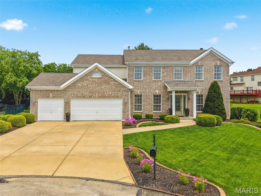 Experience refined living in this stunning 4-bedroom, 4.5 bathroom, 2 story home with over 4,000 sq. ft. of living space surrounding the Winghaven golf course. The home has been thoughtfully updated, blending elegance and functionality, all situated on a cul-de-sac lot in the Fort Zumwalt West school district. With nearly a half acre lot, the spacious backyard, large patio, mature trees and beautiful landscaping provide an excellent space to play and entertain. The gourmet kitchen is the centerpiece of the home, with quartz counter tops, upgraded KitchenAid stainless steel appliances, custom cabinets w/ undermount lighting, contemporary backsplash, walk-in pantry, wine rack and high end refrigerator (included). The main level offers newer hardwood flooring throughout the formal dining room, the office/play area and the living room highlighted by a gas fireplace, bay windows and overhead lighting. The master bedroom suite features vaulted ceilings and an incredible walk-in closet, and the updated master bath features dual quartz top sinks, soaking tub, seamless glass shower and plenty of natural light. Bedrooms 2 & 3 share a beautifully updated Jack-and-Jill bathroom and both have walk-in closets. A 4th bedroom, additional full bathroom and spacious loft area round out the upper level of the home. The partially finished basement has a great rec area, additional sleeping room, a full bathroom, multiple closets and storage areas, perfect for kids toys and holiday decor. Additional features include a zoned HVAC system, irrigation system, upgraded front and rear exterior doors w/ privacy glass, newer 2 inch window blinds throughout, gutter/leaf guards, smart garage door w/ battery backup, a 3 car garage and so much more. Just a short golf cart ride away from the beautiful Winghaven Country Club with its Jack Nichlaus designed golf course, swimming pool and restaurant. If you have been dreaming of modern updates that deliver both grander and warmth, this property delivers unmatched quality and comfort that you will enjoy for years to come.