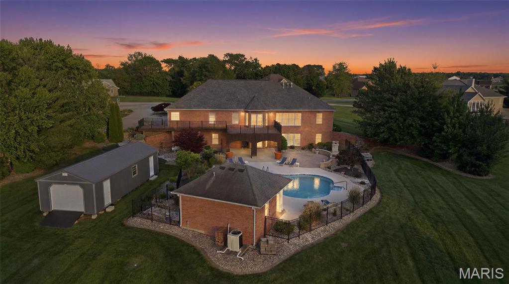 Property has appraised over asking price!! Welcome to this stunning all-brick estate situated on 2.65 beautifully landscaped acres in a highly desirable neighborhood. Thoughtfully updated throughout, this exceptional property was designed for comfort, luxury, and entertaining on every level.

The home features 6 spacious bedrooms, 4 full bathrooms, and 1 half bathroom in the main home, along with a dedicated pool bathroom and outdoor shower for added convenience. Inside, you’ll find beautiful hardwood floors, two gas fireplaces on the main level and basement, a theater room, and a massive open basement entertainment area complete with a large wet bar—perfect for hosting gatherings, game days, and holidays. The layout flows beautifully for entertaining both indoors and outdoors.

Step outside to your own private retreat featuring an in-ground pool, pool house with outdoor wet bar, expansive composite deck, and a stunning stone outdoor fireplace patio area surrounded by mature landscaping.

Additional highlights include a 3-car attached garage, detached garage, storage shed, radon mitigation system, reverse osmosis system, water softener, and surround sound system.

This rare property combines space, privacy, updates, and resort-style amenities in one incredible package just minutes from town.