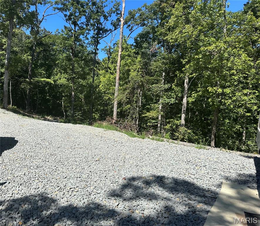 Escape to your own weekend retreat at Heather Dr. in the desirable Goose Creek Lake subdivision! This corner lot is cleared, terraced, and ready for fun, complete with a Cedar Creek fifth wheel RV featuring three slide-outs and a generator—perfect for instant relaxation and entertaining. Ample space for a boat parking/storage and maybe another camper. Bring your ideas!

Ownership in Goose Creek Lake offers endless amenities: a newer pool, 2 boat ramps, multiple fishing lakes, playgrounds, campsites, and year-round community activities including poker runs, movie nights, fishing tournaments, and more. Whether you’re looking for a peaceful getaway or a vibrant lake community lifestyle, this property has it all.