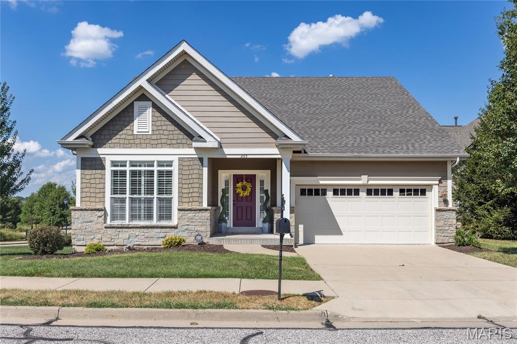 BEAUTIFUL best describes this 55+ villa community.  This villa is a stand alone (not attached to another unit), it sits on a corner lot and backs to trees.  Sidewalks, community club house and tucked away where it is quiet.  But still very close to shopping, restaurants, grocery stores and more.
This villa has hardwood flooring, that just is beaming when you open the door, private dining room, two bedrooms, great room with fireplace, breakfast room, screened in porch that backs to trees.  The lower level is waiting with a roughed in bath should you choose to finish it.  This is a must see to appreciate all it has to offer.