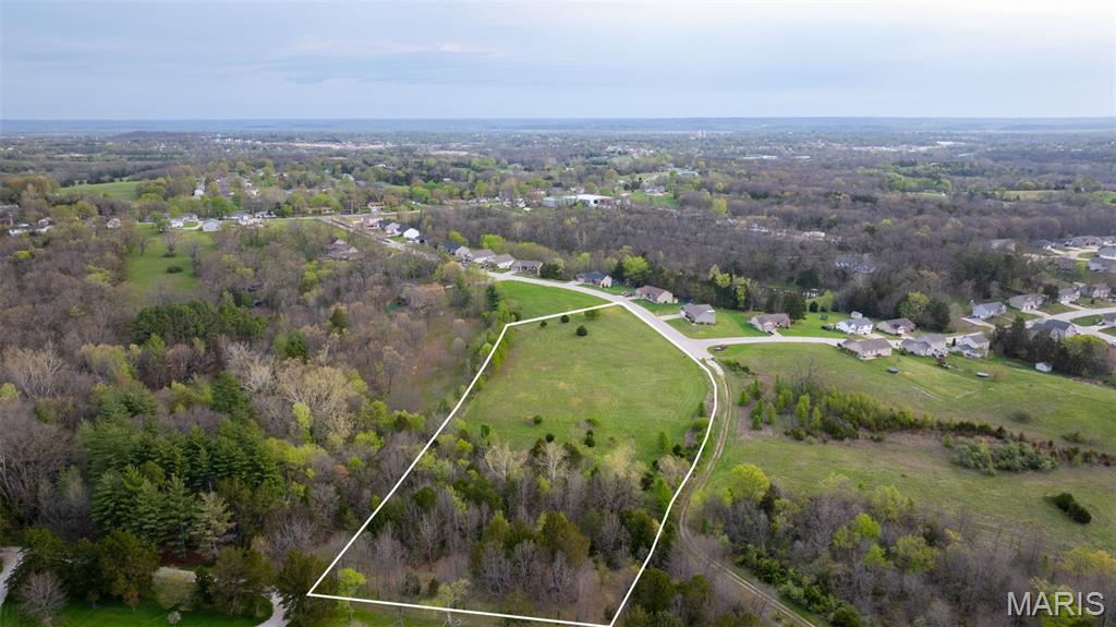 Hard to find 5 m/l acre lot just outside the city limits of Washington, MO! This beautiful property offers a mostly level to gently sloping landscape, making it ideal for building your dream home or for future development opportunities. The land is primarily open ground, complemented by just under 2 acres of wooded area featuring a scenic wet weather creek that adds character and privacy.

Utilities are already in place with underground electric and access to public water, saving you time and expense as you plan your build. While the property is not currently part of an HOA, it may be included in the future. Buyers or their agents should contact the listing agent for additional details.

Opportunities like this are rare in the Washington area, especially with this combination of size, usability, and location. Whether you’re a builder looking for your next project or a buyer wanting a spacious homesite close to town and everyday amenities, this property checks all the boxes. Don’t miss your chance, properties like this don’t last long!