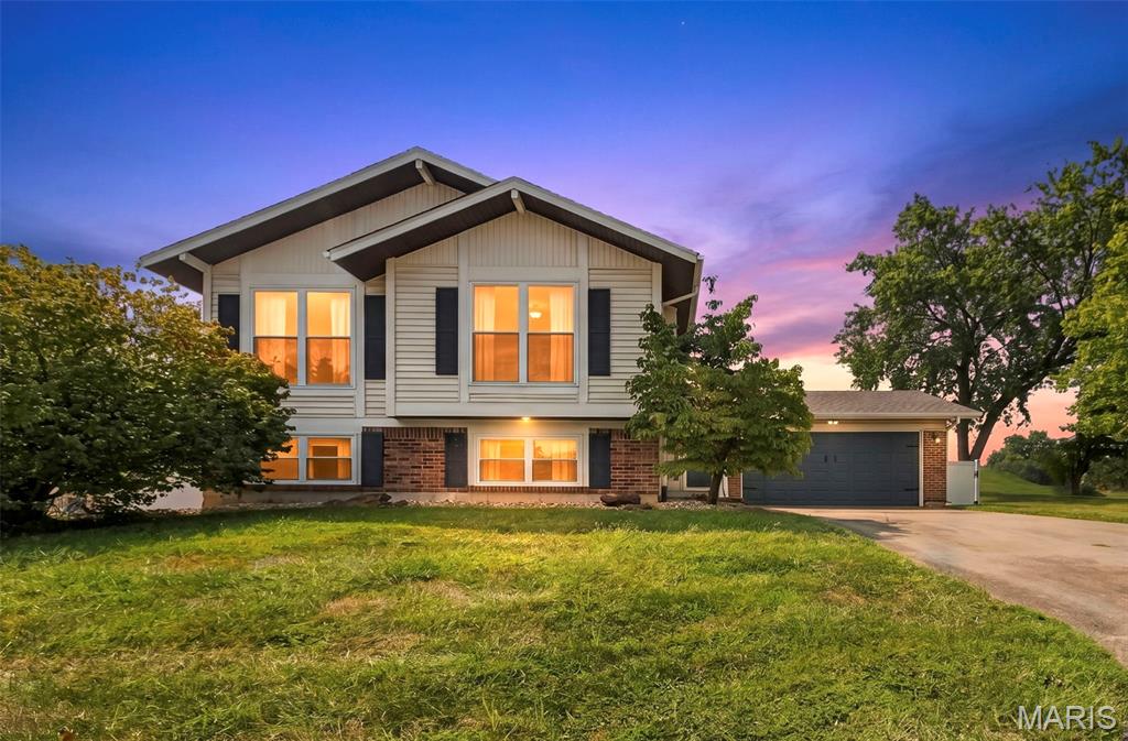 An amazing opportunity to be had. This wonderful home is well situated with high end updates galore. Exterior offers Vinyl Privacy Fence (2023), New 26 x 16 Deck (2026), New Windows (2021-2023) and a large concrete patio with service door garage. No expense was sparred on the interior updates. Refinished Hardwood Floors on main level and new carpet in bedrooms (2026), High End Kitchen Remodel in 2022. Both baths remodeled to perfection with custom tile floors and showers. Lower Level offers 800 Sq. Ft of additional living space, a gas fireplace, a 4th bedroom and exercise room. Additional Updates include Electrical Panel (2021), HVAC (2021), Water Heater (2023) and Roof (2020). This home provides years of low maintenance living, a stunning example of pride in ownership.