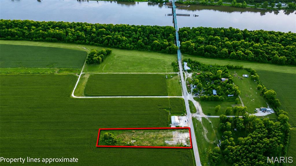 Located in South Greene County, just before the Joe Page Bridge in Hardin, IL.. FLEXIBLE zoning allows for so many uses at this location. From commercial to camping. What are you needing a level, usable tract of land for? Come see if this location will work for you. Plat map and legal description available. This location is in the flood plain, any building that is permanent will need Greene County flood plain approval. Ameren electric is on site, water available and a new holding tank is on site. Buyer to verify school district.