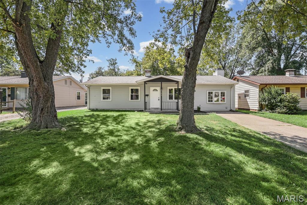 Come check out this totally rehabbed home that features 3 bedrooms and 1 bath. NEW flooring thru out the home.   Walk into the home to a spacious living room with front window for tons of light.  The kitchen is thru the Living room with NEW cabinets, Granite counters, flooring and NEW appliances.  There is a bonus room in the back of the kitchen with tons of windows and space and a door to walk out to the yard and a covered patio with a 12 x 11 concrete slab to relax outside under the shade and get your grillin on.  Off the living room is a big family room with a wood burning fireplace, another bay window, and a door out back. and Plenty of space and room to hang out.  The 3 bedrooms and bath that is fully remodeled are on the other side of the kitchen.  This home is close to everything you could need and want. Come check it out.  Professional pictures coming Saturday.