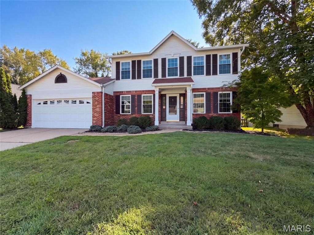 This Florissant home provides refreshed two-story living with brick curb appeal, an attached garage, and a tree-lined yard. Inside, a bright main level includes neutral paint, updated flooring, ceiling fans, and a living area anchored by a fireplace with built-in shelving. The kitchen features warm wood cabinetry, stainless-steel appliances, an island, and an easy connection to nearby dining space. Bedrooms include soft carpet, natural light, and practical closet storage, while the bathrooms provide updated vanity areas and tub/shower combinations. A finished lower-level space adds flexibility, with additional unfinished storage and utility space nearby. Recent work included flooring, cleaning, landscaping, garage repairs, paint touchups, and related updates. Included 100-Day Home Warranty with buyer activation