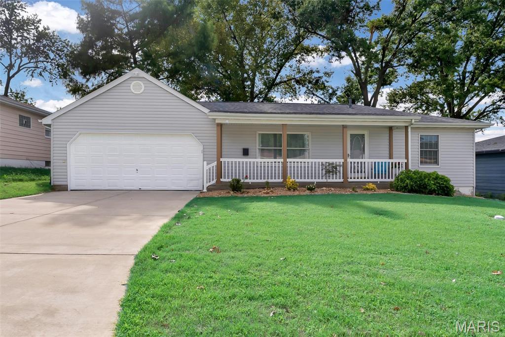 Character & Charm! Welcome to this well-maintained 2-bedroom, 1-bath ranch style home offering a warm and inviting atmosphere. This charming home features a spacious living room, cozy sunroom, fresh paint throughout, main-level laundry, plus additional laundry access in the basement. Enjoy the new deck, newer roof and siding, and fresh landscaping. 
The large, level, fenced backyard offers plenty of space for outdoor enjoyment and includes a shed, covered front porch, and an oversized 2-car garage measuring approximately 21' wide x 32' long, providing plenty of room for vehicles, storage, hobbies, and more!
Conveniently located near Highway 70 with easy access to Highway 364 and 40/61, plus shopping, dining, and everyday amenities.
Don’t miss the opportunity to make this charming and well-maintained home your own. Schedule your showing today!