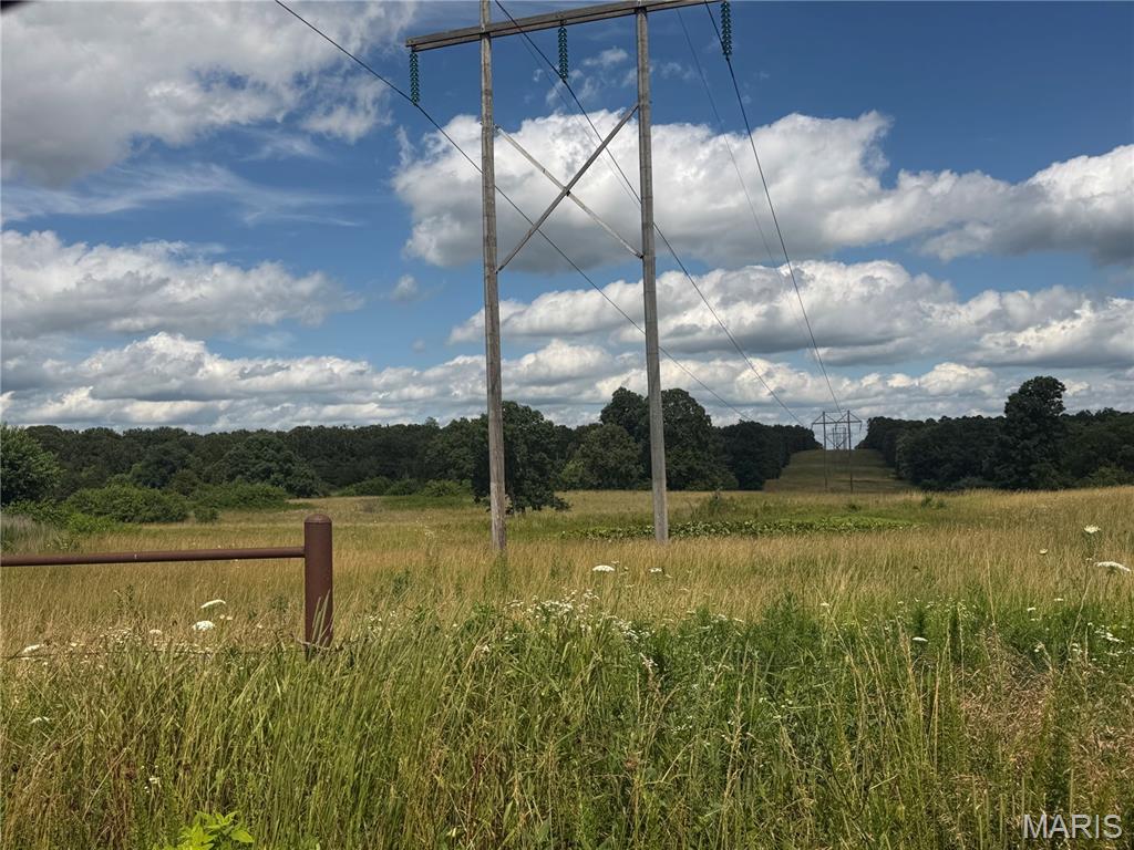 Life in the country is calling! This beautiful 35+ acre parcel is full of great views and endless possibilities. Originally part of a larger farm, this was used as a hay field and has a good crop of fescue along with three stock ponds and partial fencing. There is an REC easement running through the property providing easy access to electricity. While the land is mostly open with some large trees, the NE portion of the property has a nice wooded area allowing for a variety of beautiful building sites or great hunting as well. Build a cabin, start your farm, bring your horses, or whatever you choose, don’t miss this special piece of land!