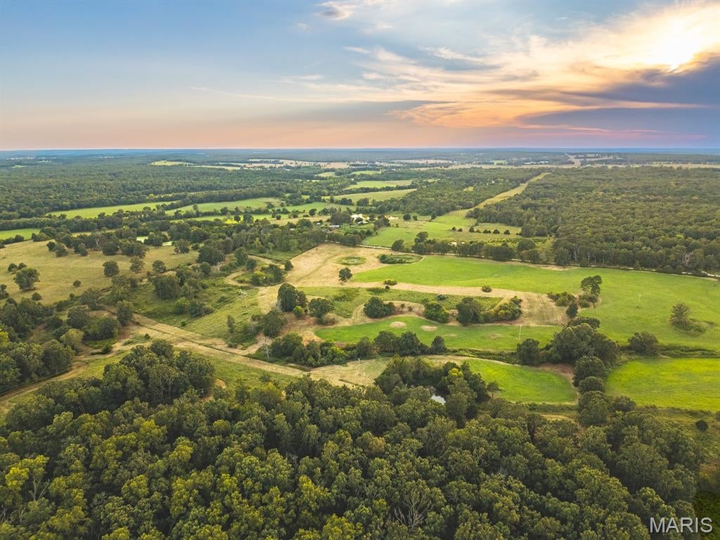 Life in the country is calling! This beautiful 35+ acre parcel is full of great views and endless possibilities. Originally part of a larger farm, this was used as a hay field and has a good crop of fescue along with three stock ponds and partial fencing. There is an REC easement running through the property providing easy access to electricity. While the land is mostly open with some large trees, the NE portion of the property has a nice wooded area allowing for a variety of beautiful building sites or great hunting as well. Build a cabin, start your farm, bring your horses, or whatever you choose, don’t miss this special piece of land!