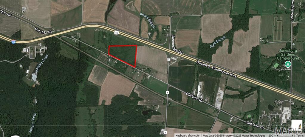Exceptional investment and development opportunity consisting of 18.47± acres in unincorporated Montgomery County, approximately 8 miles east of Google’s planned $15 billion data center campus and Amazon Web Services’ $10 billion data center investment near New Florence. Positioned along what is emerging as a major technology and infrastructure corridor, the property also benefits from the planned $581 million expansion of I-70 to six lanes, with the recently rebuilt Route Y/E (Exit 183) interchange approximately one mile east. The parcel features gently rolling upland terrain, FEMA Zone X minimal flood hazard status, and is part of a three-parcel assemblage totaling approximately 49.59 acres with 3,700± linear feet of combined interstate/arterial frontage. Potential uses include highway commercial, data-center-adjacent flex/light industrial, contractor staging or laydown, logistics/support services, and long-term land investment, subject to zoning and utility verification. Seller seeks to sell all 3 parcels together. This is a rare opportunity to secure a strategic land position along the I-70 corridor in the path of significant public and private investment transforming Montgomery County.