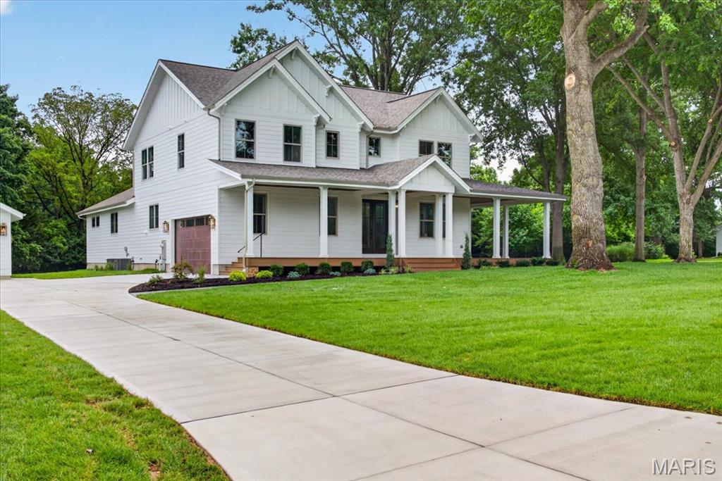 Timeless and distinguished here on Beacon Hill Lane in Creve Coeur.  Custom Built in 2026 by award-winning builder.  Starting with mature trees, privacy, large level one acre lot with irrigation system, and new sod.   Sophistication and relaxed elegance greet you with a sprawling wrap around composite decking porch entry placed perfectly on site.  Offering a blend of upscale design and laid-back comfort. A warm open-concept perfect for both family living, entertaining, or work flow. The heart of the home, features a two story stone hearth bringing a rustic touch to a modern gourmet kitchen with top-of-the-line stainless steel appliances, sleek quartz countertops.  The highlight feature the charming laundry/drop zone with access to the primary bedroom or hallway from foyer, such a great amenity with dual access points.  This home is over 3000 sq.ft. marrying form and function, boasting sleek lines and a layout that maximizes both space and light. Every detail has been carefully curated.  Enter off the foyer to your home office w/ french doors. Open-concept living spaces are an entertainer's dream, a seamless flow from the gourmet kitchen to the scullery kitchen offering tucked away storage for small appliances and the mess that can wait till later! Retreat to the primary suite, a haven of comfort with views overlooking a great size backyard.  This divided floor plan allows for the family to spread out and gather with ease. Upstairs features three bedrooms, two full bathrooms and a loft family room AND second laundry hook-ups.  Located in prime location and quick jump to HWY 270 or 141.  This one stands out from the rest!