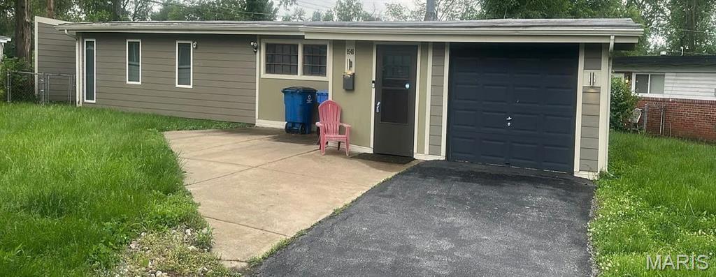 SHORT SALE!  Charming 3-bedroom, 2-bath home on a level lot with a 1-car garage. Features include a cozy wood-burning fireplace, skylight for added natural light, and a functional kitchen with island. Great opportunity for a buyer looking to add their personal touch and build equity. Short sale—subject to lender approval.