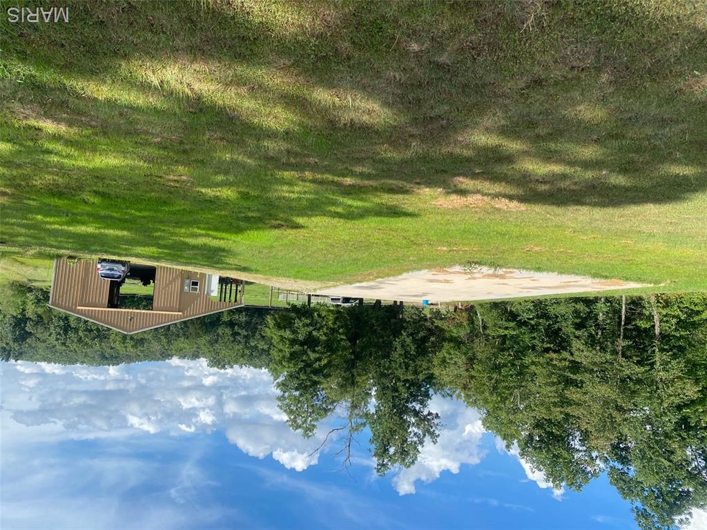 Live off the grid on this 20 acres of flat to rolling hills just a short gravel drive from Highway T.  Ready for your horses!2-Barn has 12’ bay doors, 10’ lean-to w/3 dutch doors, storage for equipment & people door. Current stalls are 12x12 and negotiable or removable. Can be used as a vacation property or permanent residence w/240 sq ft living quarters in the insulated barn. w/wood lined wall, kitchen w/fridge & microwave, full bath, & family/sleeping room. Window in the barn and living space cooled with window unit and heated w/electric heater. Tankless water heater that services the living quarters could also be used an added wash bay for horses. Other housing options include a one-room cabin/guest house w/2 lofts, is solar power & has water hydrant outside. It would be easy to add its own driveway. Or build your new home on the graded and prepared for 3 bedroom home 50’x26’ slab plumbed for kitchen. 8.5 acres of electrified fencing encompasses 5 sep horse pasture w/water accessible. Septic and drain field is designed for 3-4 bedrooms. Well is in place with 3 hydrants including one between pasture 4/5.  2 acre hay pasture, 10 acres of woods includes dry creek and beach area. This property is close to several lovely vacation and trail riding spots such as St Francois, St Joe, Elephant Rock, Tom Sauk Mountain, Johnson Shut-ins, Sam A Baker & just minutes from the Castor River Conservation area. Great hunting in the area: Elk, Trophy buck, Turkey. Low Taxes!