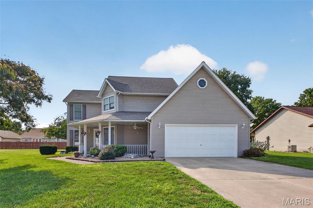 Welcome home to this well-maintained gem near Dupo's community park, complete with recreational trails, pickleball courts, a splash pad, and pavilions perfect for family gatherings and parties. This home has been meticulously cared for, with some major updates already done for you: roof and hot water heater both replaced in 2023, Anderson windows replaced in 2020, and the exterior professionally power-washed with a transferable 2-year warranty. An adorable front porch sets the tone for this inviting home. Gorgeous hardwood floors flow through the main level, while the eat-in kitchen boasts quartz countertops and tile flooring. French doors lead out to a patio with a partially privacy-fenced area, ideal for entertaining or relaxing evenings outdoors. Main-level laundry adds everyday convenience. Upstairs, you'll find three bedrooms, including a primary suite with freshly painted bathroom and skylight for natural lighting, a walk-in closet, and walk-in shower. This is a must-see for anyone wanting move-in-ready comfort.  Schedule your showing today! Agent related