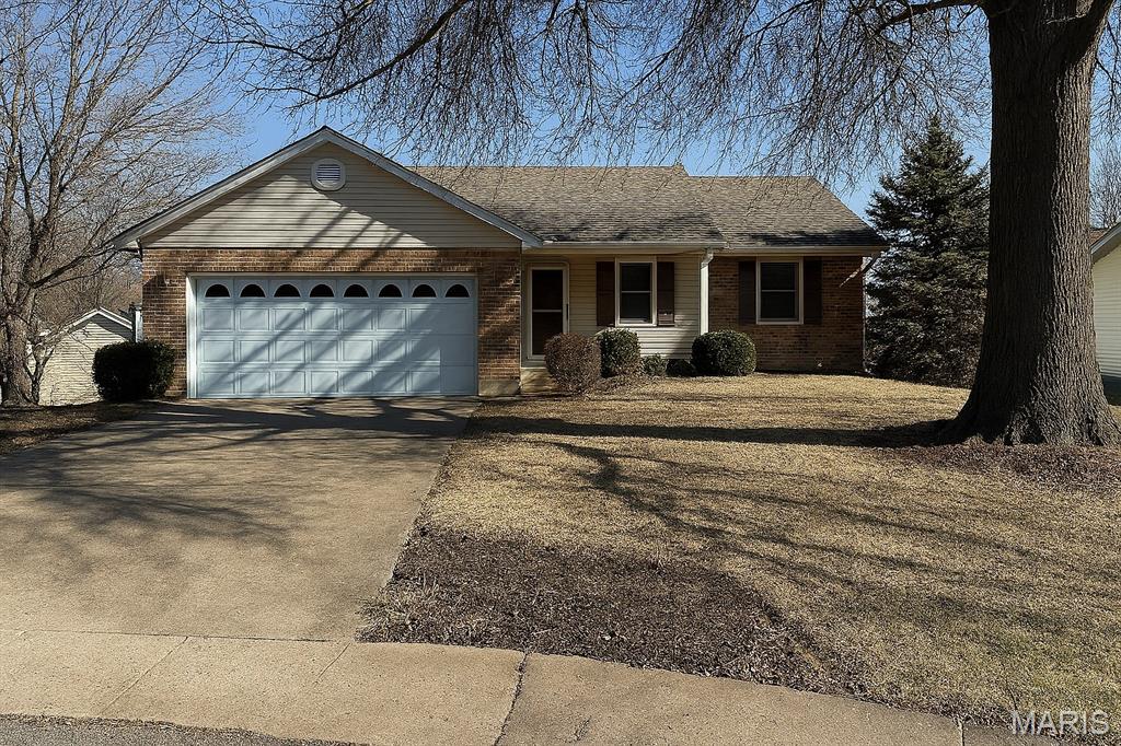 This beautifully updated, move-in-ready 4-bed, 3-bath home sits at the end of a quiet cul-de-sac near St. Francis Borgia High School. Recent updates include a newer roof and brand-new carpet. The main level offers hardwood floors, granite countertops, a main-floor primary suite, and main-floor laundry. Step out onto the spacious composite deck overlooking the peaceful backyard. The finished walkout basement adds a bedroom, full bath, generous storage, and excellent space for entertaining in the large family room.