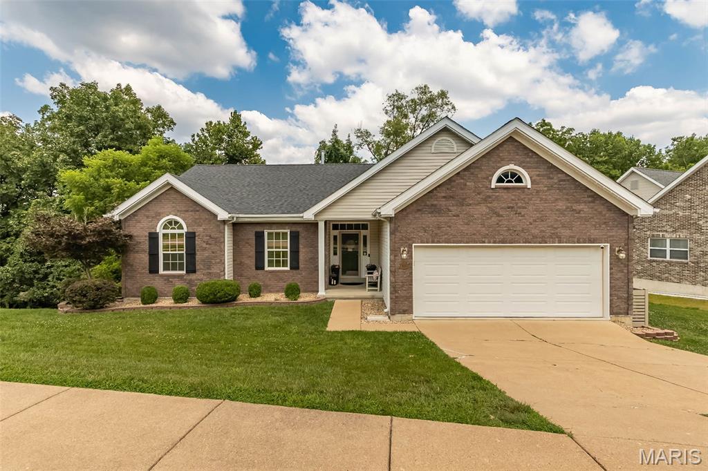 Updated Ranch in AAA Rockwood School District at an Amazing New Price! Welcome home to this beautifully maintained 3+ bedroom, full bath ranch offering an ideal blend of modern updates, comfortable living, and an outstanding location. From the moment you arrive, you'll appreciate the attractive brick front elevation, manicured landscaping, and inviting curb appeal. Step inside to a spacious vaulted great room featuring a striking floor-to-ceiling stone fireplace, luxury wood flooring, and abundant natural light. The updated kitchen is designed for both everyday living and entertaining with granite countertops, custom cabinetry, tile backsplash, breakfast bar, black appliances, and an adjoining breakfast room overlooking the private backyard. The spacious primary suite offers a relaxing retreat with a
beautifully renovated spa-inspired bath featuring a double vanity, soaking tub, and custom tile shower. Two additional main-floor
bedrooms and another updated full bath complete the main level. The finished walkout lower level significantly expands the living space
with a large recreation/family room, possible fourth bedroom or home office, third full bath, and plenty of storage—perfect for guests,
hobbies, or multi-generational living. Roof is only 1 year old too!
Financial Inf