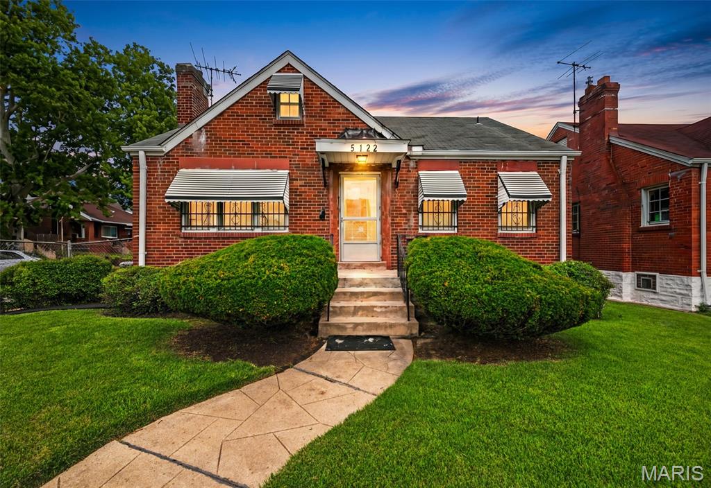Charming all-brick 2-bedroom, 1-bath home offering timeless character and plenty of potential. Beneath the existing carpet, hardwood flooring is believed to be present, providing an opportunity to enhance the home's original appeal. The enclosed porch offers additional versatile living space, perfect for relaxing, hobbies, or seasonal enjoyment. Outside, you'll find a beautifully maintained and well-manicured yard, a fully fenced backyard ideal for outdoor activities, a convenient carport, and a detached 1-car garage for additional parking or storage. This property combines classic brick construction with functional outdoor amenities and pride of ownership throughout. Conveniently located near public transportation, shopping, dining, and major roadways. Don't miss the opportunity to make this charming property your own.