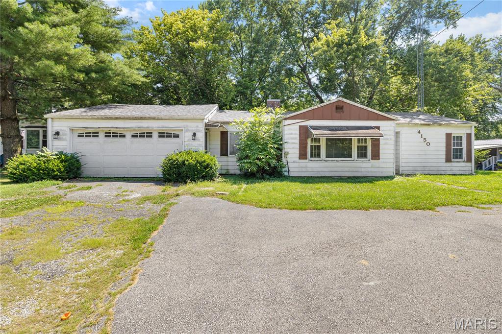 BACK ON THE MARKET!!!  Fantastic opportunity to own this 1,350 square foot 4 bedroom, 1 bath home situated on a spacious 1/2 +/- acre lot that backs to mature trees and woods, offering a peaceful setting with added privacy. The property features a circular driveway and a 2 car attached garage. Whether you're an investor, flipper, or buyer looking to build equity, this home offers outstanding potential with a little TLC. Major updates include a roof installed approximately 3 years ago by United Builders, an HVAC system approximately 6 years old, and a water heater approximately 6 years old. Property is being sold As Is. Seller will make no repairs. Cash or Conventional financing only.