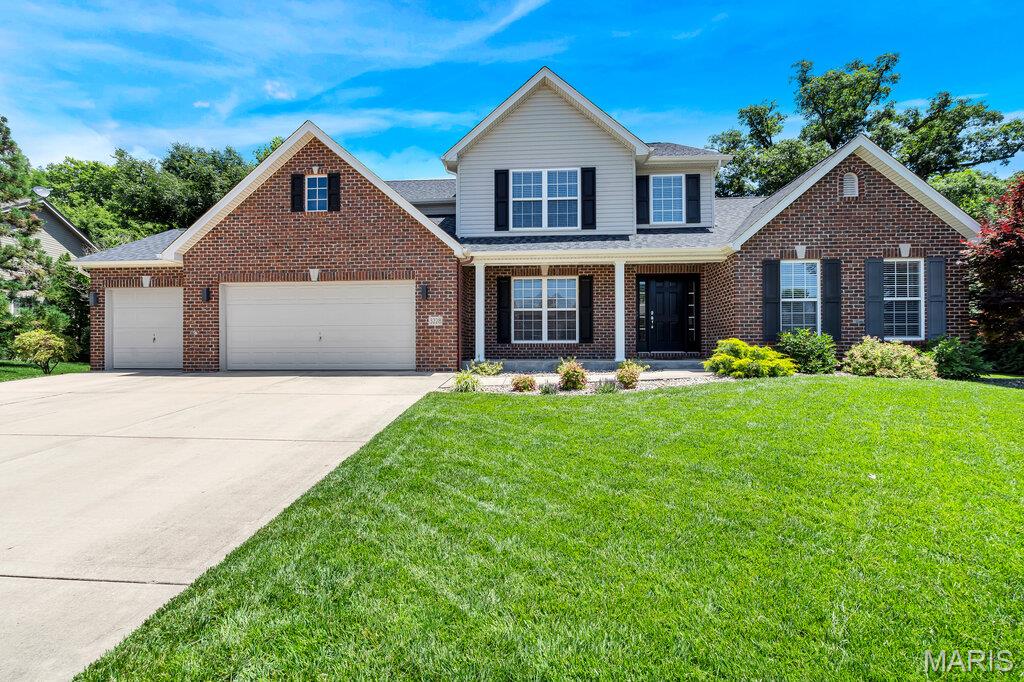 Gorgeous 4 bed / 3 bath executive-style home in the highly sought-after FREEBURG SCHOOL DISTRICT, featuring a luxury outdoor living space and a private wooded backdrop. Located in Belleville’s desirable Maple Hill subdivision, this property offers quick access to Hwy 15 for an easy commute and showcases thoughtful upgrades throughout.

A formal two-story foyer with a central staircase opens to the impressive two-story living room, complete with arched window and 2” blinds. High ceilings and luxury finishes set the tone from the moment you enter. The formal dining room features hardwood flooring and provides an elegant space for entertaining.

The custom kitchen is a standout with 42” maple cabinetry, natural stone counters, double sink, 5-burner stainless stove, pantry, and a convenient desk/beverage station. The adjoining breakfast room flows seamlessly into the expansive hearth room—an inviting space with an ultra-high coffered ceiling, a wall of windows, inset crown molding, and built-ins. From the breakfast room, step out to the incredible 2023 outdoor entertainment area, designed for game-day lounging, cozy evenings, and gatherings with friends. The backyard backs to woods and a low-traffic road, offering privacy and serenity.

MAIN FLOOR LAUNDRY and a MAIN FLOOR MASTER SUITE make this a true forever home. The spacious master bedroom features a tray ceiling, six-foot windows, and a generous walk-in closet. The remodeled ensuite (2020) includes a modern soaking tub, heated ceramic flooring, walk-in double shower, quartz double vanities, and a separate powder room.

A centrally located main-floor half bath adds convenience, and the oversized 3-car garage provides ample room for tools, toys, and transportation. The unfinished basement—with double windows—offers endless potential for future expansion.

Upstairs, bedrooms #2, 3, and 4 are all nicely sized with double closets and share a hall bath with a tub/shower combo. 

Major updates include: 2024 Roof with impact-resistant architectural shingles (insurance savings potential), 2022 Laundry room remodel; 2020 Master bath remodel with quartz counters; 2020 Back patio & entertainment area. This home is beautifully maintained, shows exceptionally well, and is available for a quick close.
