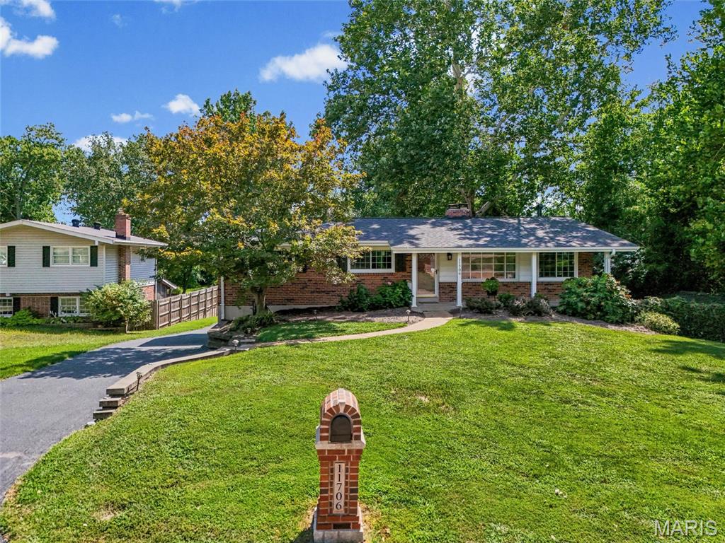(Back on market due to no fault of seller and did not go through any inspections.) 
Home has a new Roof, new Windows, driveway repaved, new flooring and more! Come see this 4-bd, 3-bt, ranch home in Sunset Hills on .85/acre picturesque property in a fantastic subdivision and Lindbergh School District.  Enter the main floor to a large living room with bamboo luxury plank flooring throughout. Move through to the large dining room with a wood-burning fireplace and matching built-in shelves on either side, which opens to a beautiful kitchen with stainless steel appliances, updated fixtures, custom white cabinetry, granite countertops, a tile backsplash, and a spacious pantry. Hall bath updated, 3 large bedrooms on the main floor, freshly painted, including a large primary bedroom with a private bath with ceramic flooring and a walk-in shower. The lower level has a walk-out, a 4th bedroom with a walk-in closet, an updated walk-in shower, a large recreation room with a wood-burning fireplace, laundry, a separate storage room with lots of shelving, and a 2-car tuck-under garage with a workshop area. The real gem is the ability to relax and enjoy this BEAUTIFUL, serene, large yard with a drum bridge, landscaping, and privacy.  Driveway recently resurfaced and sealed and so much more!  Fantastic for entertaining or just enjoying the view!