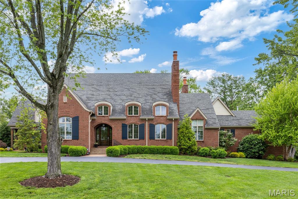 This stunning Will-built brick 1.5 Sty features 5789 sf of living space enhanced by barrel-vaulted ceilings, arched entryways & oak hardwoods that extend throughout the main living area. Impressive covered porch entrance with 8’ mahogany front door with glass panes leads to marble foyer with groin vault ceiling, well-appointed study, striking living room highlighted by limestone fireplace, formal dining room and gathering bar. Designer kitchen with 42” buff cabinetry, granite countertops, commercial grade appliances, 10’ center island & butler's pantry adjoins light-filled breakfast room & family room with timber-beamed ceiling, stone fireplace & bank of windows that overlook parklike grounds. Vaulted primary bedroom suite with luxury bath with shower spa & jetted tub offers an appealing retreat. The 2nd floor extends the living quarters with 3 additional ensuite bedrooms & bonus room. Situated on a 1+ acre cul-de-sac lot with screened in porch with full-height fireplace & 3-car garage.