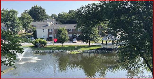 Professional pictures will be ready next week! 
CONDO WITH A LAKE VIEW! This gorgeous end unit sits directly across from the lake and fountain, offering peaceful views and incredibly convenient, low-step entry (only 5 half steps with dual handrails to the front door). Boasting 1,118 sq. ft. of turn-key living space, this is one of the largest layouts in the complex! Step inside to a freshly painted, spacious floor plan flooded with natural light. The great room features a cozy wood-burning fireplace and a massive storage closet. The dining room includes a sliding door to your private back patio—the perfect spot to enjoy summer nights. The masterfully updated kitchen highlights custom cabinets and stainless-steel appliances. Both large bedrooms boast ample closet space and share a beautifully updated bathroom. Extra storage room off the patio, plus washer, dryer, and refrigerator stay! Enjoy Brentwood Forest amenities: lakeside trails, tennis courts, two pools, walking paths, and immediate building access to open parking bays. Walk to shopping/dining with easy access to major highways, Clayton, WashU, SLU, and Downtown St. Louis. Schedule your showing today!