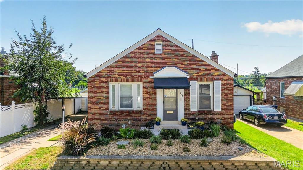 Welcome to this charming home in the desirable Princeton Heights neighborhood! Beautiful hardwood floors, stained glass windows, coved ceilings, and a built-in corner cabinet in the dining room add character and timeless appeal throughout. The spacious kitchen has 3 walls of granite countertops, stainless appliances and white cabinets.   Two main floor bedrooms have hardwood floors with original woodwork. Enjoy the bright four-season sunporch, featuring an abundance of windows that fill the space with natural light. The finished lower level offers a large recreation room, perfect for additional living space, a home office, or entertaining, along with a spacious laundry area, laundry chute and loads of storage, including multiple closets with original wood doors. Step outside to the low-maintenance Trex ground-level deck, surrounded by a retaining wall and beautifully landscaped area for easy maintenance. Parking is a breeze with a one-car garage and one-car carport. Additional highlights include updated windows and a new roof in March of 2026! Situated on a quiet street with peaceful neighbors and conveniently located near shopping, Wilmore Park, and all that South City has to offer. A wonderful opportunity to enjoy classic charm, thoughtful updates, and versatile living space in a fantastic location!
