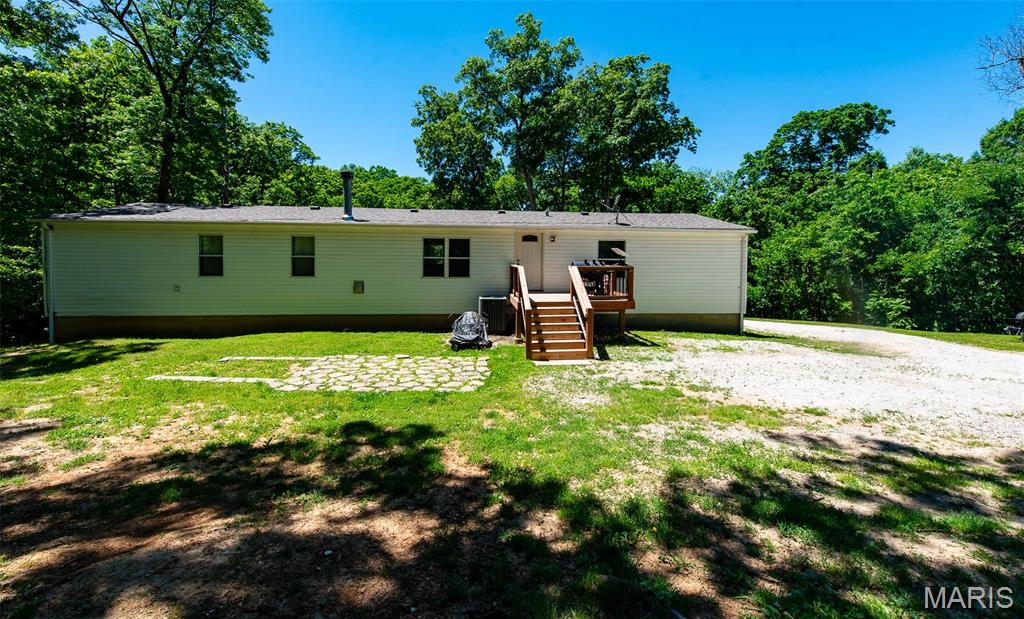 Spacious 4 bedroom, 2 bath, full walk out basement, private setting on 3.46 acres at end of cul de sac. Plenty of room inside and out.  Newer roof, newer heating and cooling, move in condition.  Finance Conventional, FHA, VA.