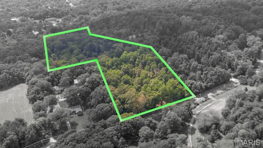 Tract# 4 of this newly split acreage for unrestricted development consists of a 7.67+/- acre timbered building lot with the country feeling of privacy & seclusion.  Located with an entrance off Old Sprigg Street Rd, this rural timbered land tract is just outside of the Cape Girardeau city limits providing an urban setting.  
With paved road access and electric utility accessible at the roadside, this exclusive lot with private recreational acreage is in a natural state and ready for excavation and construction for whatever a Buyer envisions.  With varying topography throughout, there are also potential areas for a pond excavation.
The wildlife is spectacular throughout this raw land.  This property was once labeled as a deer sanctuary and home to an abundance of whitetail deer and much other wildlife that frequent the area.  
This rarely available property with no deed restrictions places you just minutes from the Downtown Cape Girardeau Riverfront business district, and shopping amenities that the city offers.