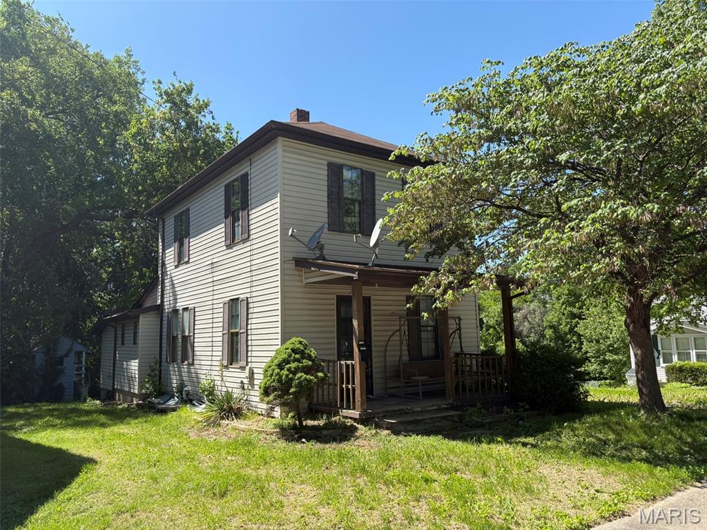 Character. Location. Opportunity.
Roomy 2 story sitting on a tree-lined lot that backs to mature woods, this 3-bedroom, 2-bath Craftsman on Plum Street is the kind of home that draws you in before you even step inside. The front porch alone: wide, welcoming, and made for slow mornings...tells you everything about how this house was built.
Inside, the Craftsman character is intact — the kind of warmth and authenticity that new construction simply can't touch. The full basement adds potential beyond what the square footage suggests, and out back a deck overlooks a wooded yard that offers privacy and a natural backdrop that feels worlds away from the street.
Then there's the location. Walkable to the library and all of Uptown Collinsville: restaurants, shops, community events, this is a neighborhood with genuine walkability and a sense of place that's increasingly hard to find at any price. This home needs cosmetic updating and is priced to reflect it, which is exactly where the opportunity lives. A recently rehabbed comparable just down the street, smaller and with one fewer bath, sold for $160,000. The math on this one is compelling for the buyer willing to put in the work.  Cash or conventional financing. Sold as-is. Homes with this much character, in this location, at this price don't stay available long.