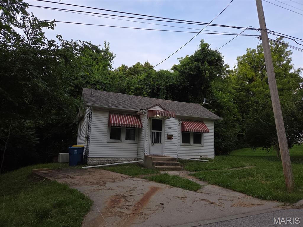 Great opportunity and PRICED to SELL to have a nice 2 bedroom with expansion capabilities with lower level walk out basement. ( Could be 3 bedroom 2 bath). House is on private street within walking distance of Downtown Edwardsville. Has new roof and new kitchen cabinet fronts. With a little TLC could be ready. Being sold as is. Seller will make no repairs or provide for inspections. Some utilities are currently on. This would be a great rental, Starter or downsize home. Please  make note in contract you are aware of buying property as is. And provide proof of funds or pre approval financing. Seller will need a 24hr response time for all offers