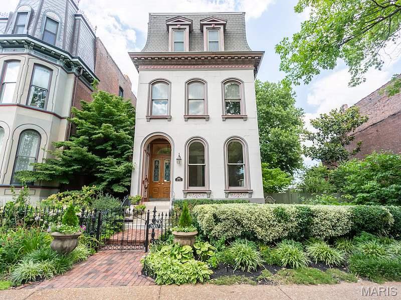 7 Bedrooms with 7 1/2 Bath recently remodeled to satisfy any demanding buyer. This mansion faces Lafayette Square!
Amaze yourself  with  unobstructed view of the Arch from two separate third floor bedrooms. Enjoy the full size lot on east side with balcony overlooking mason built brick patio with koi pond awaiting your filling with water and goldfish. Garden has a covered party gazebo, electric and sound. This party pad accommodates 6 guests. Separate covered gazebo accommodates two in conversation or solitary reading! 
3 car garage with electric door openers and has specious storage. The floor plan has possible layout for a resident operating an AirBnb accommodating up to 4 guests. 
A resident can still claim an entire upstairs floor for their solitary enjoyment!