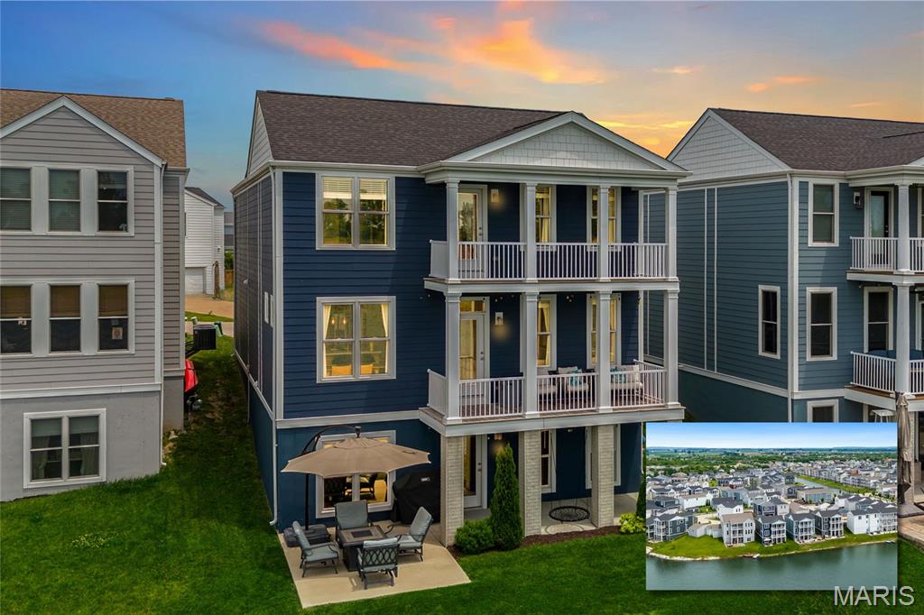 Stunning waterfront 2 story home with double stacked porches located on a quiet street in the popular community of New Town in St Charles! This home boasts 4 bedrooms, 2.5 bathrooms, and 2,080 square feet of living space.

The front door opens to the entry foyer with a coat closet that leads to the spacious living room, which opens to the kitchen. The kitchen boasts 42 inch cabinetry, black stainless steel appliances, new sink (2024), breakfast bar, and a dining area. The stylish powder room completes the main level.

The second floor features the primary bedroom with a private porch overlooking the lake and a luxurious bathroom. The primary bathroom boasts a dual vanity, soaking tub, separate shower, linen closet, newer light fixtures, and a walk-in closet. Three additional bedrooms, a full hall bathroom, loft area, and laundry room complete the second level.

The walkout lower level features ample storage space and a workout area with windows overlooking the lake. Other highlights include: 2 car attached garage, 1 car detached garage, 9 foot ceilings on main level, Nest thermostat, Ring security cameras, extensive landscaping, and many newer light fixtures throughout.

Relax on one of the two covered porches or on the extended concrete patio in the backyard and enjoy the view of the lake and Boschert Trail on the other side. Location could not be better – close to major highways, restaurants, shops, schools, and walking distance or a short golf cart ride to all that New Town has to offer!