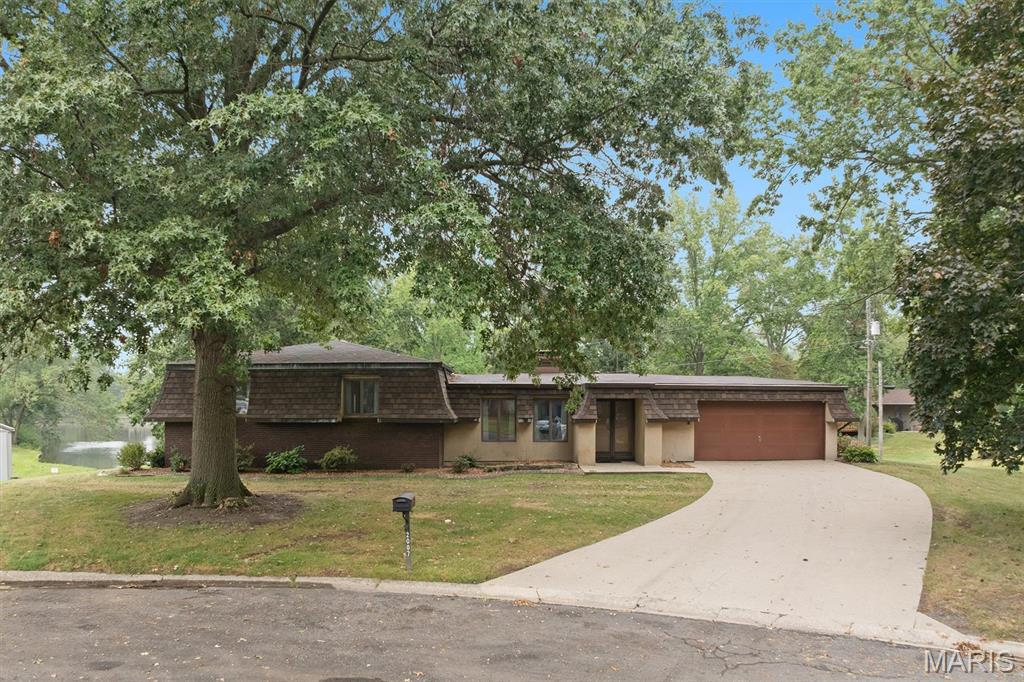 Rare lakefront opportunity in the charming community of Highland!  Nestled on a quiet cul-de-sac, this spacious multi-level home offers over 3000 sq.ft. of living space with 3 bedrooms, 3.5 baths, and a sunroom overlooking the lake.  Enjoy beautiful water views and the peaceful setting this property provides.  The walkout basement includes two bonus rooms (not included in sq ft) offering endless possibilities for a home office, recreation room, guest space, hobby room or additional storage.  With its generous floor plan, desirable waterfront location and great potential, this home is ready for your personal touches and updates.  A fantastic opportunity to build instant equity while enjoying lakefront living.  Don't miss your chance to make this waterfront property your own!