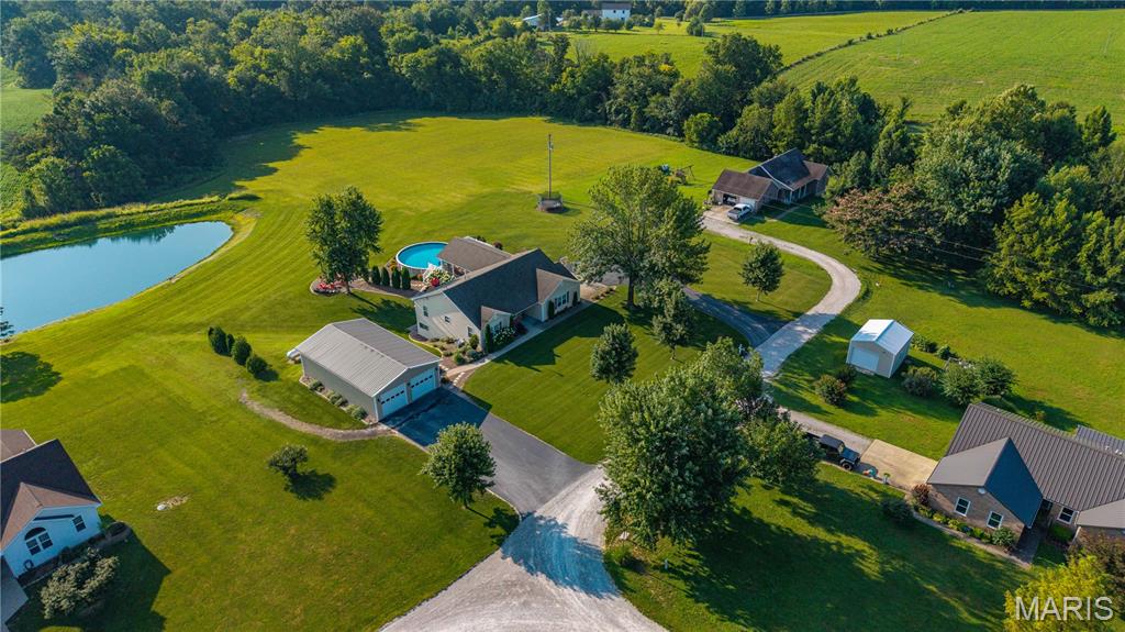 ***BACK ON MARKET--at NO FAULT of the seller!***
THE BEST of both worlds! —beautifully updated home, on approximately one acre in a peaceful country setting, yet just minutes from everything in Jackson! Step inside and you'll immediately see why this one stands out, with nearly 2,900 square feet of finished living space, an open floor plan, soaring vaulted ceilings, quartz countertops and LVT flooring throughout. 
With 3 bedrooms and 3 full baths, there’s plenty of room to spread out; and the finished walkout basement offers even more possibilities, including a 4th nonconforming sleeping area perfect for guests, a home office, workout space or whatever fits your life.
But wait...there is MORE! The property is just as good outside! Step onto the huge screened-in patio, then out to the composite deck and above-ground pool. It’s the kind of backyard made for summer evenings, weekend get-togethers or simply sitting outside by the firepit and enjoying a little peace and quiet.
And then there’s the shop! The 26x42 shop with its own paved driveway gives you serious space for vehicles, equipment, projects, hobbies or all the things you never seem to have enough room for.
Updated home. Approx 1 acre lot. Finished walkout basement. Pool. Incredible outdoor living space. A 26x42 shop. You don’t find all of this in one property every day! 
*Inspection report available upon request*
Come see for yourself why life is sweeter on Raspberry Lane.

*Pond is not located on the property.