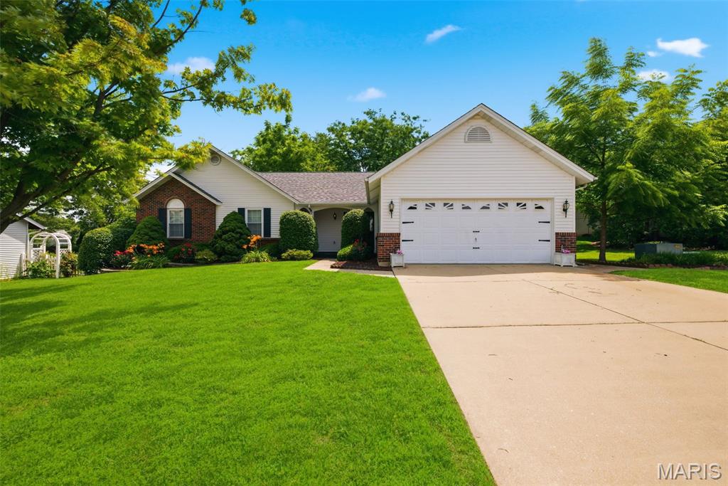 Well-maintained 3-bedroom, 3-bath ranch offering main-level living space plus an expansive unfinished lower level ready for future finish. Spacious vaulted great room features skylights, exposed beam accents, and a brick gas fireplace. The kitchen opens to the breakfast room and offers ample cabinet and counter space. Separate formal dining room provides additional entertaining space. The primary suite features a walk-in closet, dual vanity, soaking tub, and separate shower. Two additional bedrooms, full hall bath, and convenient main-floor laundry hookups in the kitchen complete the main level. Additional laundry hookups are also available in the basement. The unfinished lower level provides excellent storage and endless possibilities for future living space. The basement includes a sump pump and offers plenty of room for a recreation area, workshop, home gym, or additional finished square footage. Seller is offering a one year home warranty to buyer! 

Enjoy the screened porch overlooking the beautifully landscaped, private backyard with mature trees and abundant green space. Additional features include an oversized 2-car garage, generous storage throughout, and a brand-new roof installed in 2026.

Lovingly maintained,  this home offers a functional floor plan, spacious room sizes, and the opportunity to personalize over time.