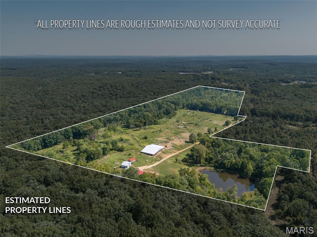 BRING THE HORSES, THE TOYS & THE FISHING POLES! Welcome to 3001 Crow Lane in Bonne Terre, where 48+/- acres offer the space and setup to enjoy country living your way. This fenced and cross-fenced property features a spacious 2,496 sq. ft. double-wide home with 4 bedrooms, 2 full baths, a large living room, family room, kitchen and laundry room. Step outside onto the full deck overlooking the property and take in everything this outdoor enthusiast's retreat has to offer. Horse lovers will appreciate the 40' x 60' riding arena with 16' lean-tos on both sides, plus an outdoor riding arena and plenty of fenced acreage ready for horses or livestock. A 30' x 30' shop provides room for equipment, projects and recreational toys, while the stocked pond adds fishing and another beautiful piece to this country setting. Whether your idea of a perfect day includes horseback riding, hunting, fishing, working the land or simply enjoying your own private acreage, this property is ready for it. 48+/- acres, room to roam and so many ways to make it yours!
PLEASE DO NOT DRIVE DOWN DRIVEWAY without approved appointment-must have pre approval letter or proof of funds for an approved showing