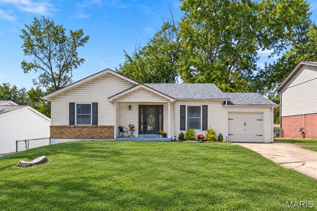 Welcome to this beautifully updated 3-bedroom, 2-bath ranch in a convenient St. Peters location! Step inside to a spacious living room featuring a cozy fireplace and a large designated dining area with plenty of room for gatherings and entertaining. The fully renovated kitchen shines with brand-new cabinetry, stainless steel appliances, a gas stove and stylish hard-surface countertops. The hall bath has been refreshed with a resurfaced bathtub, while the comfortable ranch-style layout offers easy everyday living. Downstairs, the updated lower level features new flooring and additional finished living space—perfect for a recreation room, home office, gym or media area. A dedicated workbench/work area provides a great space for projects, hobbies or additional storage. Outside, enjoy a fenced backyard with plenty of room to relax, entertain or play. A one-car attached garage adds even more convenience and storage. Freshly updated, move-in ready and filled with functional living space, this St. Peters home is ready for its next owner! Added features:  New roof and shed roof(2025), new LPV floors upstairs (2024) and basement (2026), fresh neutral paint throughout (2024 & 2025) and new HVAC (2025).
