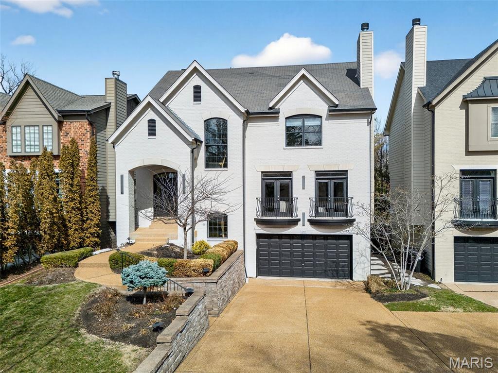 Step into luxury in this beautiful 2004 four-bedroom, four-and-a-half-bathroom University City home. From the moment you enter, you’ll know you’ve arrived somewhere special. The open living space, soaring ceilings, rich hardwood floors, and elegant dining area create an immediate impression. Just off the entrance, the inviting great room features a gas fireplace and oversized windows, making it the perfect place to relax. As you move into the hearth room, you’ll find yet another gas fireplace—ideal for cozy gatherings. The spacious kitchen offers ample room for cooking and dining, and French doors lead to a beautiful deck overlooking a generously sized backyard and stunning pool oasis. A wet bar and powder room complete the main level. Upstairs, the primary suite is a true retreat, featuring a large closet with custom shelving and a spa-like en suite bathroom with both a soaking tub and a separate shower. Three additional bedrooms and two full bathrooms, including a Jack-and-Jill suite, offer flexible space for family, guests, or a home office. A conveniently located upstairs washer and dryer hookup makes everyday living even easier. The basement offers flexible space for a home gym, entertainment area, or pool prep zone, along with an additional washer and dryer hookup and full bathroom. Step outside to enjoy the patio - perfect for summer barbecues and hosting pool parties. With recessed lighting throughout, built-in speakers, a two-car garage, and just a two-minute drive to Clayton, this home truly has it all.