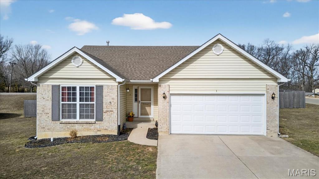 Welcome to 1 Cuivre River Drive! Nestled on a spacious 1/3-acre level lot in the desirable Cuivre Valley subdivision, this beautifully maintained home offers the perfect blend of comfort, style, and convenience. Located just a half mile from Cuivre River State Park, near Cuivre Park Elementary, and with easy access to Hwy 61, the location is ideal for both outdoor enthusiasts and commuters. 
Step inside to discover vaulted ceilings, an open lower-level staircase, panel doors, and ceiling fans throughout. The inviting living area features a cozy wood-burning fireplace, flowing seamlessly into the open kitchen complete with updated stainless steel appliances. The main floor offers convenient laundry and a spacious primary suite with vaulted ceilings and a private en suite bath. The newly finished lower level (2025) expands your living space with a large rec room, bonus room, half bath, and additional storage. Outside, enjoy the covered front porch, brick exterior, wooden privacy fence, extended garage storage, and newer A/C. This move-in ready home offers thoughtful updates, flexible living space, and a fantastic location — don’t miss your opportunity to call it home!