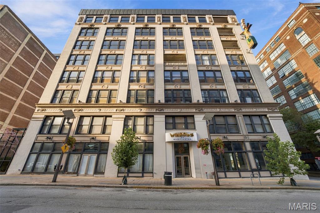 Welcome to Windows Lofts! Located in the heart of downtown St. Louis, on one of the most popular stretches of Washington Avenue. Neighboring an endless list of food & fun, right out your front door. This total package unit exemplifies loft-living with exposed brick walls, polished concrete floors and a wall of oversized windows with fun city views of the City Museum. This ideal 2nd floor unit boasts an open functional layout with over 1,200sqft, 1 generously sized bedroom, 2 full bathrooms and bonus storage room. Primary suite features walk-in closet and ensuite bathroom, complete with jacuzzi tub. Unit includes 1 assigned parking space in LL attached garage. Lower than average HOA fee includes water, sewer, trash and basic cable utilities. Unit has been a successful income producing rental property for several years and can either be owner occupied or continue as a LTR (no STR permitted).