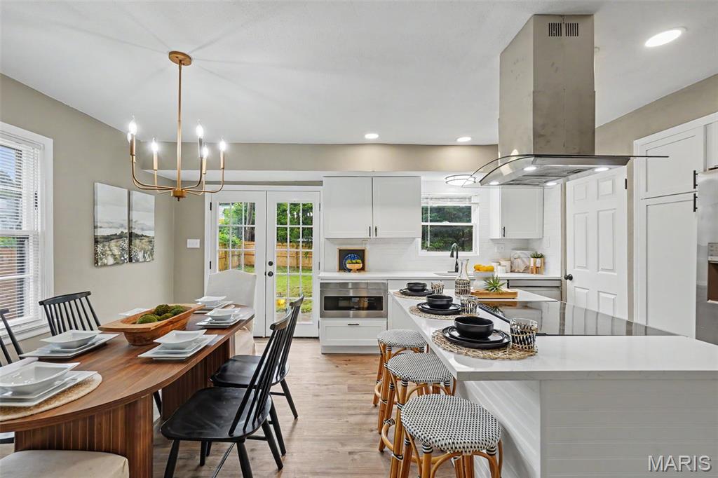 Completely reimagined from top to bottom, this beautifully renovated Cape Cod-inspired home reflects a thoughtful balance of timeless architectural character, modern design, quality craftsmanship & lasting functionality. Rather than simply updating finishes, this comprehensive renovation thoughtfully reinterprets a classic American home for the way people live today.

The kitchen couples sophisticated design with exceptional functionality. Quartz countertops, custom cabinetry, a spacious center island, built-in drawer microwave, smart range & designer hood create a space equally suited for everyday living & entertaining. Oversized French doors replace the original rear entry, filling the space with natural light while creating a seamless connection to the new deck. The adjoining living room offers a gathering space highlighted by hardwood floors & natural light.

The spacious main-level primary provides the convenience of single-level living & is complemented by a beautifully renovated  bathroom & walk-in closet. An adjoining bedroom creates exceptional flexibility as a nursery, home office, sitting room, dressing room, library, fitness studio, or traditional bedroom while adjoining the primary.

Positioned near the foyer, the front main-level bedroom offers additional versatility as a guest bedroom, home office, media room, family room, or private retreat, adapting easily to changing household needs.

Upstairs, two additional bedrooms are complemented by a full bathroom & an expansive loft that serves beautifully as a media room, playroom, study area, reading lounge, or second family room.

The expansive lower level further extends the home's flexibility with nearly 800 s.f. of bright, clean, immediately usable space. Freshly painted walls, ceilings & floors create a clean contemporary aesthetic rarely found in unfinished basements. Ideal for recreation, fitness, hobbies, a workshop, entertaining, or storage, the lower level also offers excellent potential for future finishing.

Throughout the home, a professionally designed interior color palette, carefully selected by an interior designer, complements the home's classic architecture while creating a cohesive, timeless aesthetic from room to room.

Beyond the finishes, this renovation represents a significant investment in the home's long-term performance. Permitted electrical, plumbing, HVAC, doors, flooring, cabinetry, kitchen, bathrooms, lighting, interior finishes & numerous additional improvements were completed throughout the renovation, providing buyers with confidence that the home's updates extend well past the immediately visible. The new rear deck is permitted, and the home has already passed the County occupancy inspection.

Situated on an oversized corner lot, the property offers exceptional outdoor space rarely found in comparable homes. The expansive backyard is enclosed by new privacy fencing, creating an ideal setting for entertaining, recreation, gardening, pets, or simply enjoying the outdoors. A second driveway provides valuable additional parking for multiple vehicles, guests, recreational equipment, or trailers, while the rear deck will create an inviting outdoor gathering space overlooking the backyard.

Located just minutes from the  newSaint Louis Zoo WildCare Park, this home offers buyers the opportunity to live near one of the region's most exciting long-term investments. Combined with convenient access to parks, shopping, dining, schools & major highways, the location provides an exceptional balance of everyday convenience & future potential.

Thoughtful design, quality construction, distinctive character & enduring attention to detail are the reasons this home was selected as part of the Penthouse Crafted Collection. This home exemplifies quality that stands the test of time.