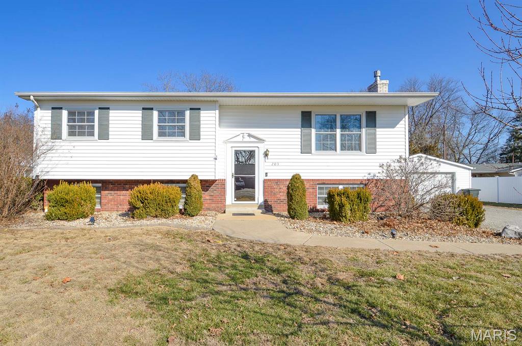 Price listed is Starting Bid Only. Bidding starts closing 3/25/2026 @ 5 p.m.  Move right into this well maintained split level home situated on a spacious corner lot in Freeburg, IL. Perfectly located near schools, parks, and local amenities, this four bedroom, two bath home offers comfort, convenience, and room to grow. The front entrance opens to a bright living room where expansive windows fill the space with natural light. The kitchen, which features Corian countertops, custom cabinetry, and all included appliances is separated from the dining area by a door that leads to both an upper and lower deck overlooking a spacious backyard. A generously sized primary bedroom is accompanied by two additional carpeted bedrooms and a beautifully appointed full bath. The finished lower level extends your living space with a cozy family room centered around a gas burning stove. A fourth bedroom with an oversized closet and a three quarter bath provides flexible living options, while the unfinished portion of the basement includes the laundry/utility room combo, complete with washer and dryer, and a workshop ideal for projects. Outside, a paved asphalt driveway leads to a detached two car garage, and the expansive yard includes a shed for outdoor enthusiasts. With downtown Freeburg’s shopping and dining just minutes away and Scott Air Force Base close by, this move in ready home is waiting for you.Property will sell under auction terms and be sold AS- IS, WHERE-IS. Seller, will not make any repairs as a result of any building, occupancy, or environmental inspections. Buyer will be required to sign an Auction Purchase & Sale Agreement if final bid is accepted by Sellers.