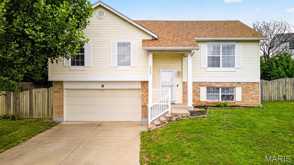 Welcome to 633 Longhorn Drive in O'Fallon! This well-maintained split-foyer home offers 4 bedrooms, 3 full bathrooms, and a functional multi-level layout designed for comfortable living. The upper level features a bright living room, spacious kitchen, and primary suite, while the lower level provides three additional bedrooms and a finished living area with a full bath ideal for guests, a home office, or growing households. Situated on a desirable cul-de-sac lot, this home includes a 2-car garage, partially finished basement, and a large backyard with plenty of space for outdoor enjoyment. Additional highlights include central air, natural gas heating, public utilities, and low annual HOA fees. Conveniently located within the highly rated Fort Zumwalt School District and close to shopping, dining, parks, and major commuter routes, this home offers an excellent opportunity to enjoy all that O'Fallon has to offer.