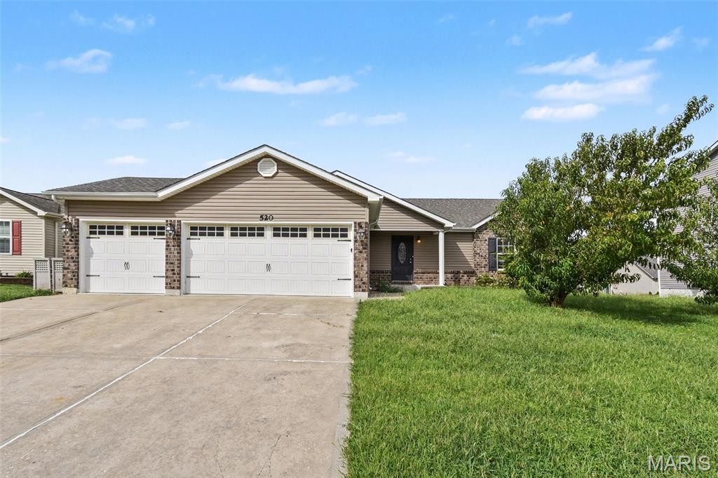 Welcome home to the highly desirable Newport Meadow community! This charming brick residence offers a functional floor plan brimming with natural light and modern style. Inside, the bright layout features vaulted ceilings, a cozy fireplace, and seamless flow into a kitchen complete with premium countertops and stainless steel appliances. The primary suite serves as a relaxing retreat with a walk-in closet, while a finished basement provides flexible extra living space. Step outside to enjoy outdoor living on your private deck overlooking a spacious backyard. Conveniently located near local parks, daily shopping, and easy commuter routes like I-70 and Highway 61, this move-in ready home provides effortless access to everything you need. Schedule your tour today!